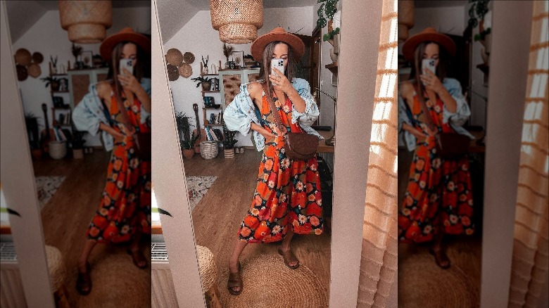 Woman standing in front of mirror