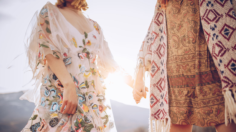 Woman holding hands with friend