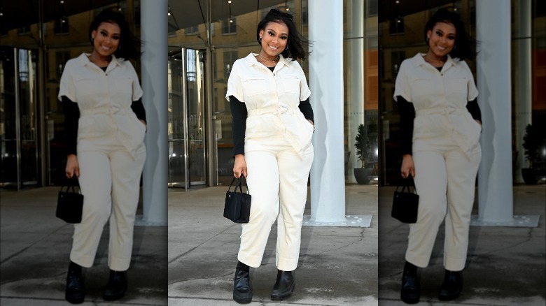 Woman wearing white boiler suit jumpsuit