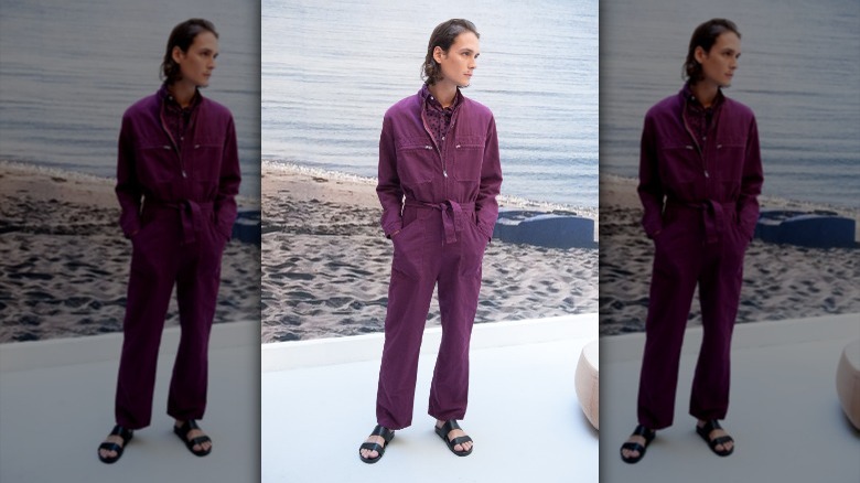 Man wearing plum purple boiler suit