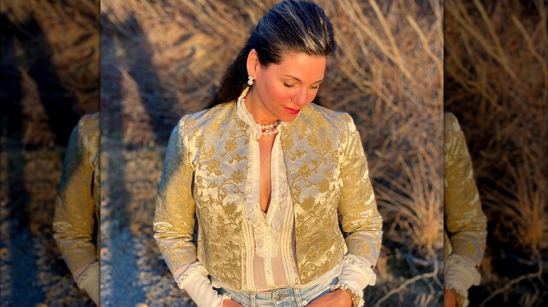 woman wearing gold silk bolero