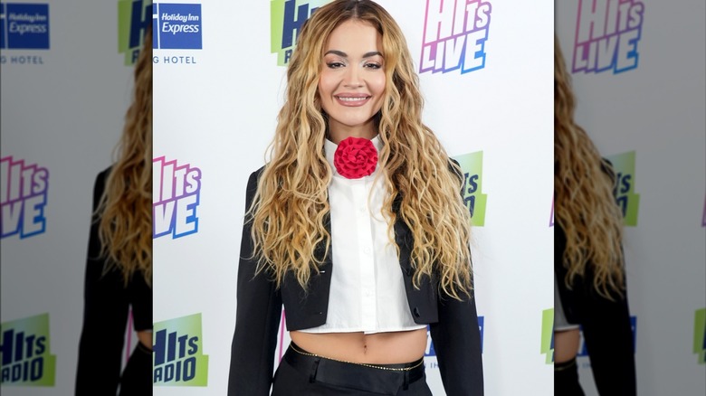 Rita Ora black bolero red flower