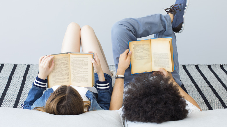 Two people reading together