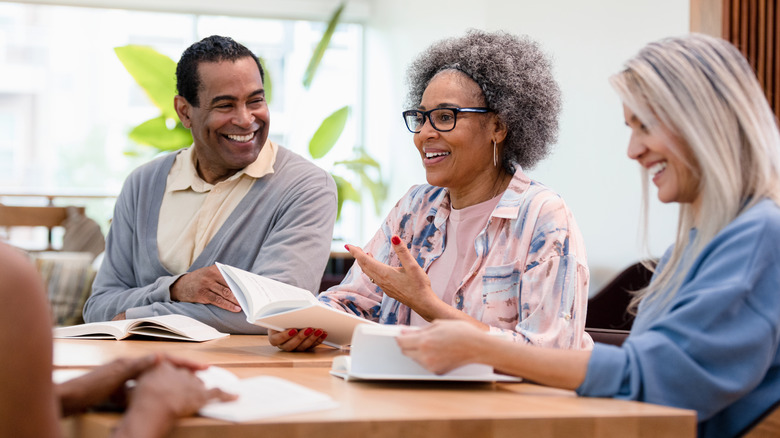 Group commiserating over book