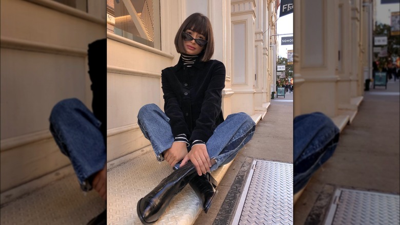 Girl wearing boots with boot-cut denim.