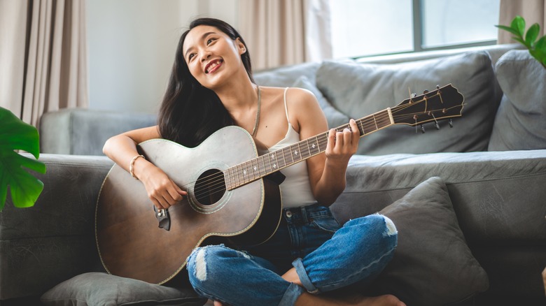 woman playing guitar