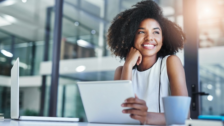 smiling woman with laptop