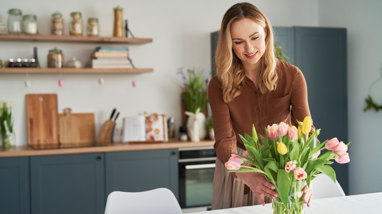 woman arranging flowers