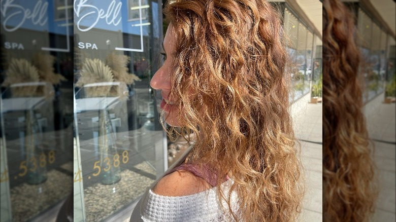 Woman with light brown wavy hair