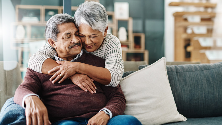 woman hugging man from behind