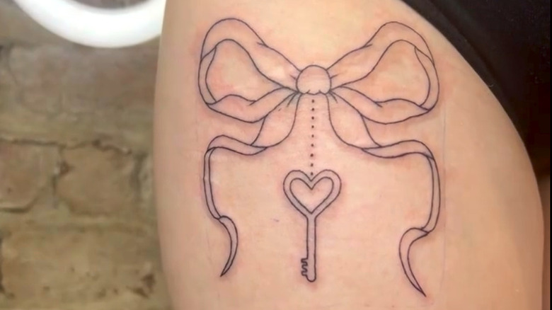 Linework bow tattoo