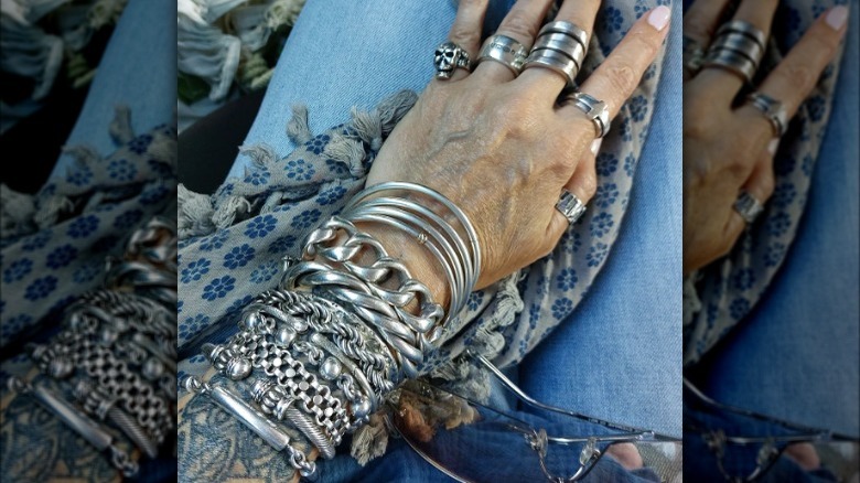 large stack of silver bangles 