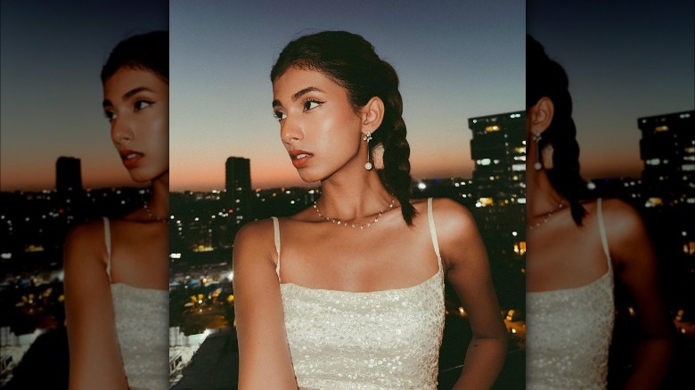 Sparkly tank top and braided ponytail