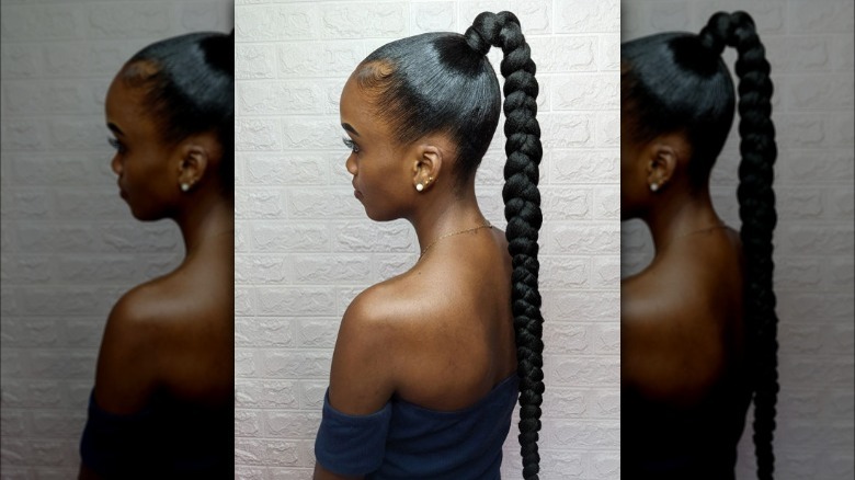 A woman with a high ponytail braid