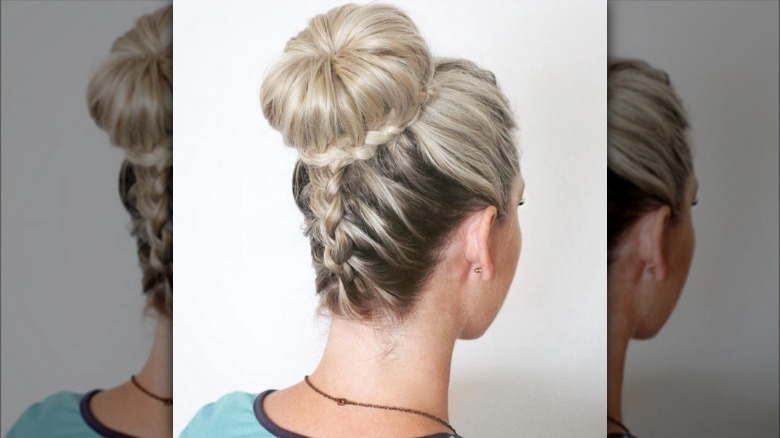 A woman with an upsidedown braid and bun