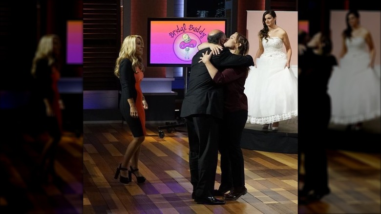 Heather Fitzner kissing Kevin O'Leary on the cheek while promoting Bridal Buddy on ABC's "Shark Tank"