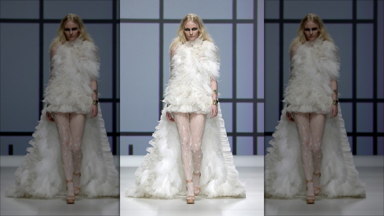Full feather gown on runway