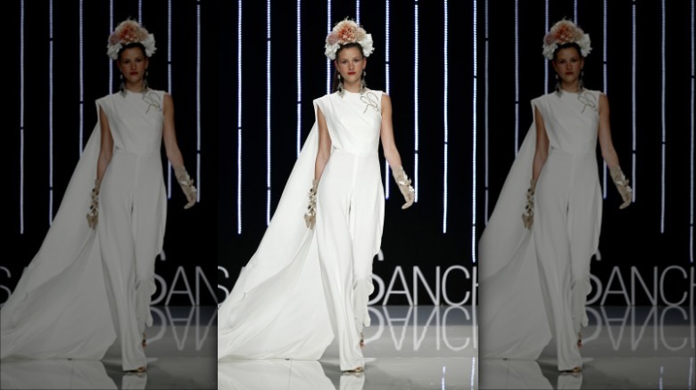 Bridal model wearing white jumpsuit