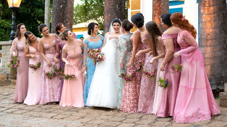 Bride and bridesmaids in mismatched dresses