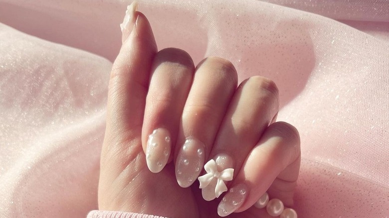 Pearls and bow coquette manicure