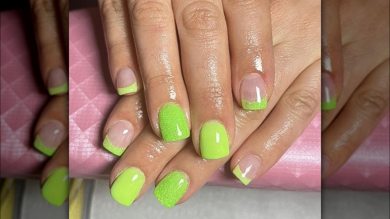 Short nails with chartreuse tips and accents