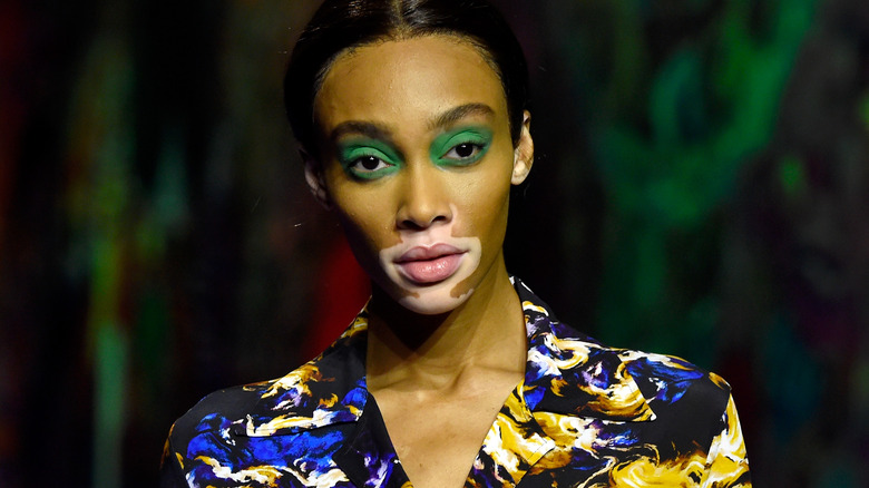 Winnie Harlow wearing green eyeshadow