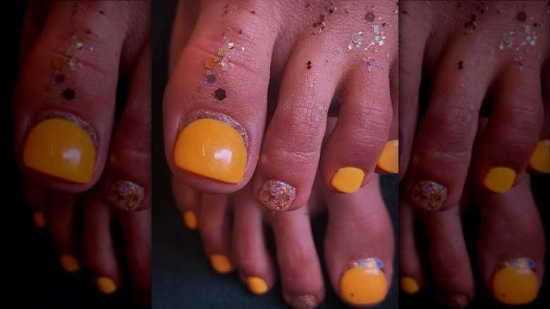 woman with glitter nail colr
