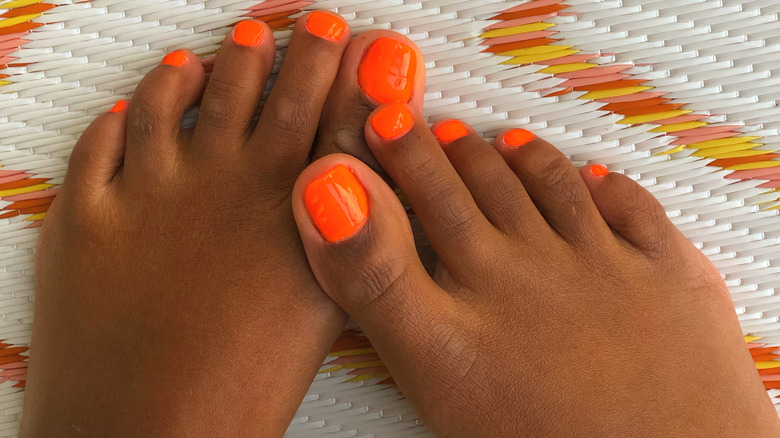 Bright Orange: The Summer Pedicure Trend Bringing Out Warm Tones In Your  Skin