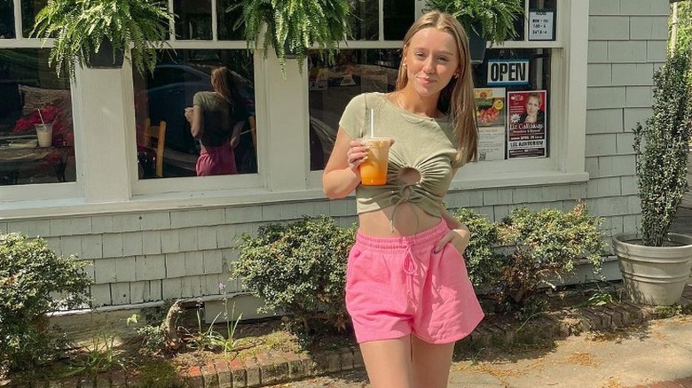 woman wearing pink sweat shorts