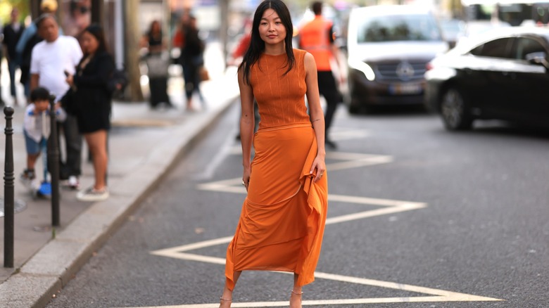 Woman wearing orange maxi dress
