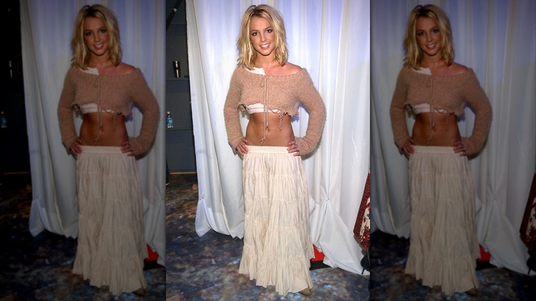 Britney Spears in a cropped sweater and a hippie skirt.