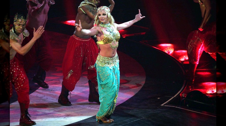 Britney Spears performing onstage in an Indian costume.