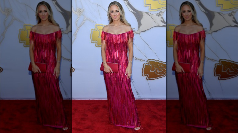 Brittany Mahomes rocking a red tinsel dress to a red carpet event.