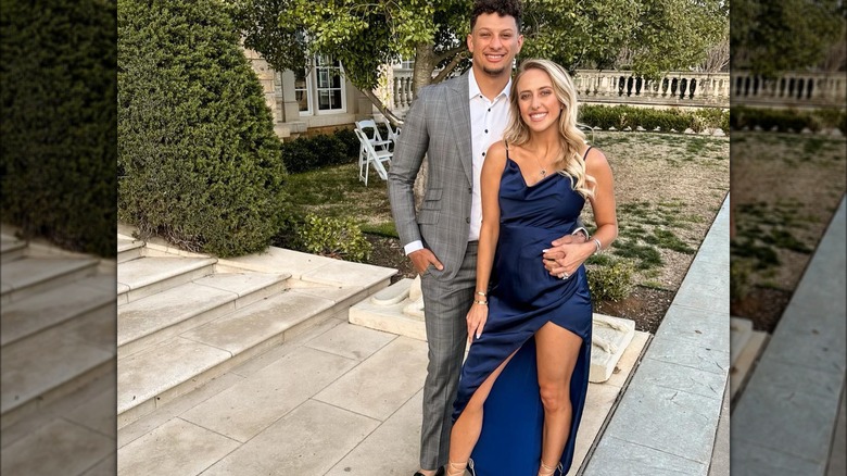 brittany mahomes wearing blue silky dress