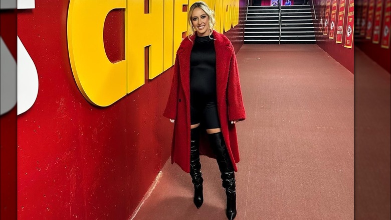 Pregnant Brittany Mahomes in fuzzy red coat