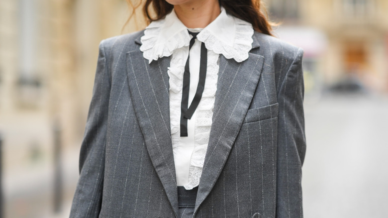 woman wearing broderie anglaise blouse