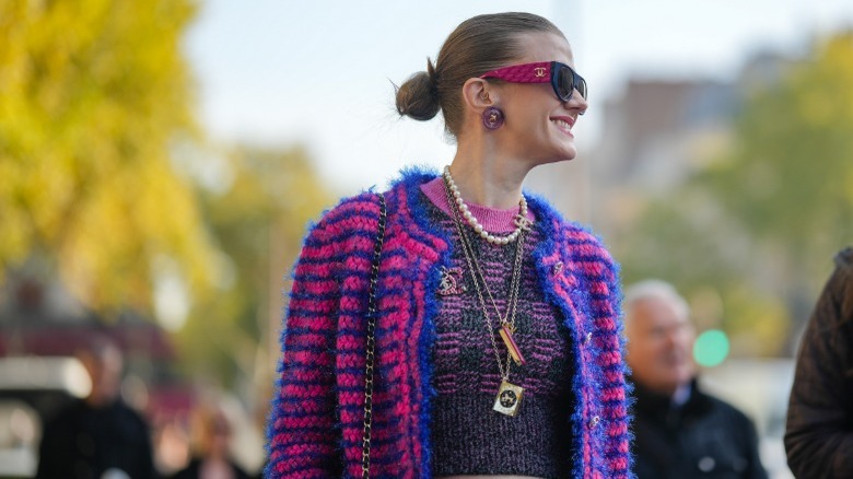 woman wearing small Chanel brooch