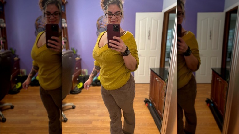 Woman wears brown pants and yellow sweater 