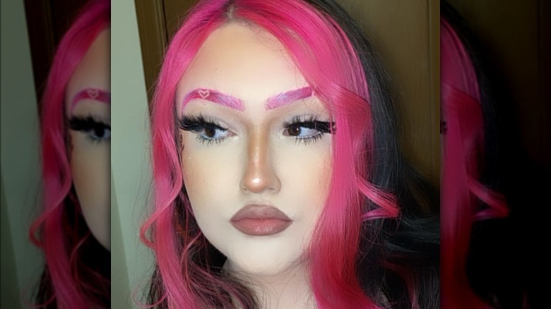 woman with pink eyebrows