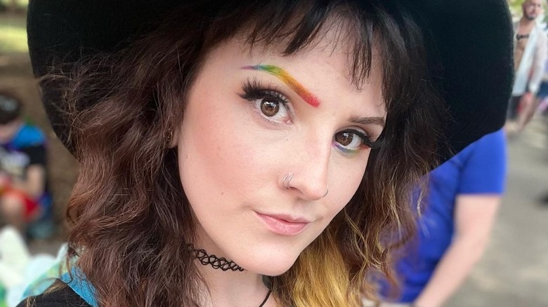 woman with rainbow eyebrows