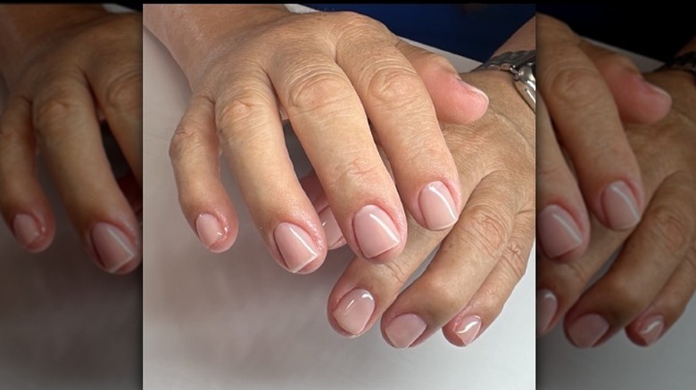 Hands with cool mauve nails