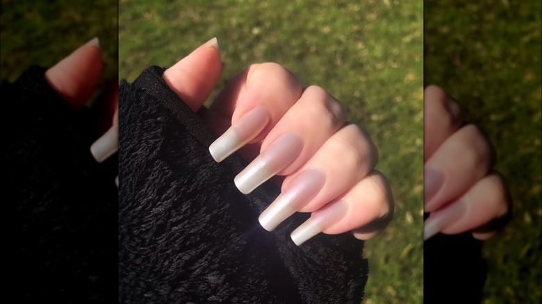 Hand with pearly sheer white nails