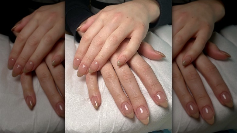 Hands with sheer beige nails