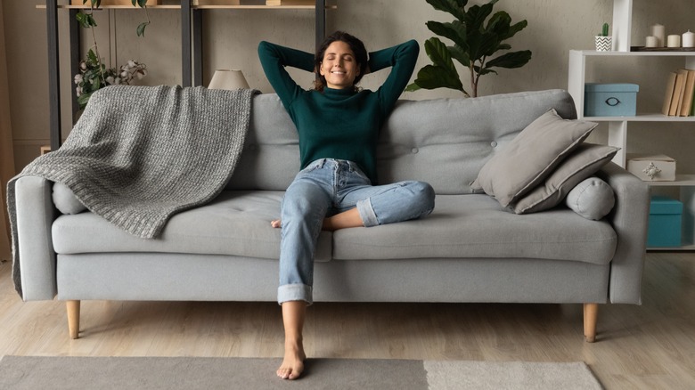 woman relaxing on couch 