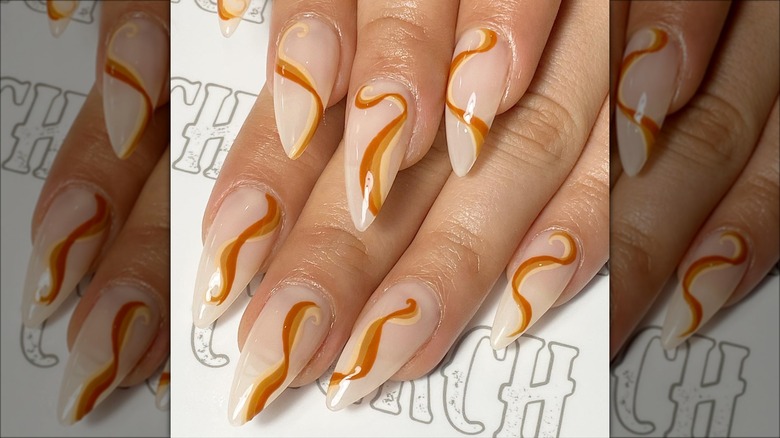Nude nails with caramel rainbow swirl designs