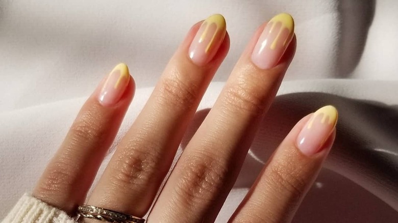 Dripping yellow french tip nails