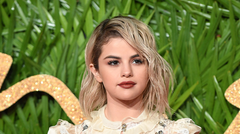 Selena Gomez's side-parted, blond hair
