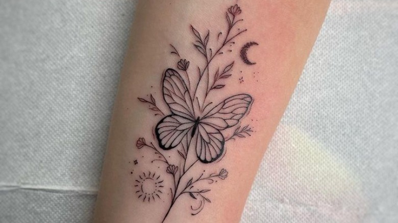 Butterfly tattoo with flowers
