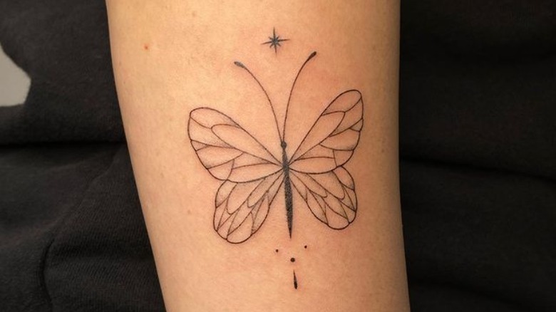 Fine line butterfly tattoo on arm