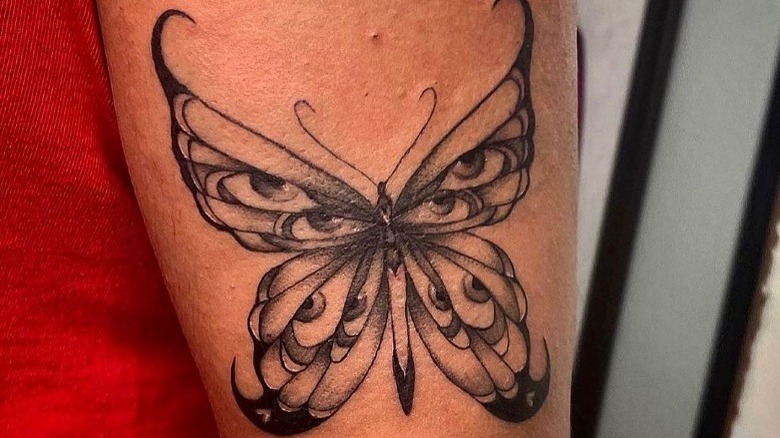 Butterfly tattoo with eyes in its wings